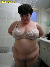 see this chubby mature have fun with a dildo